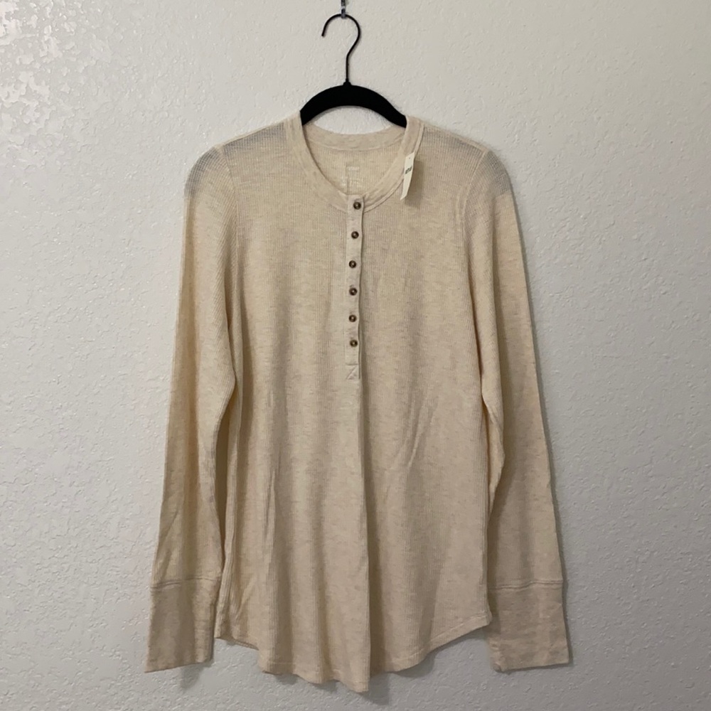 cream colored long sleeve with buttons